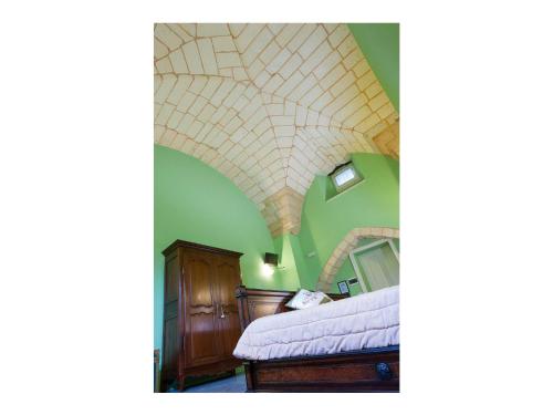 Ένα ή περισσότερα κρεβάτια σε δωμάτιο στο Palazzo Mellacqua