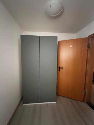 an empty room with a closet and a door at Metzgerei Herbst in Besigheim