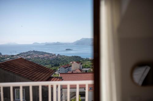 a view of the ocean from a balcony at Apartments Micika in Cavtat