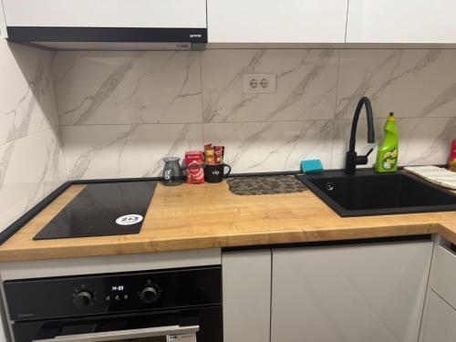 Kuchyň nebo kuchyňský kout v ubytování Apartman MINA