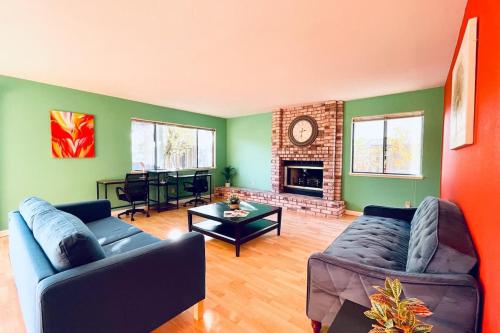 a living room with two couches and a fireplace at Vallejo Beautiful 4br Home wt Mountain View Napa in Vallejo