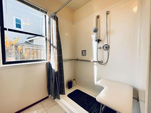 a bathroom with a shower and a sink and a window at Vallejo Beautiful 4br Home wt Mountain View Napa in Vallejo