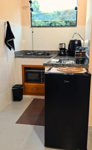 Dapur atau dapur kecil di Chalé Refúgio da Pedra