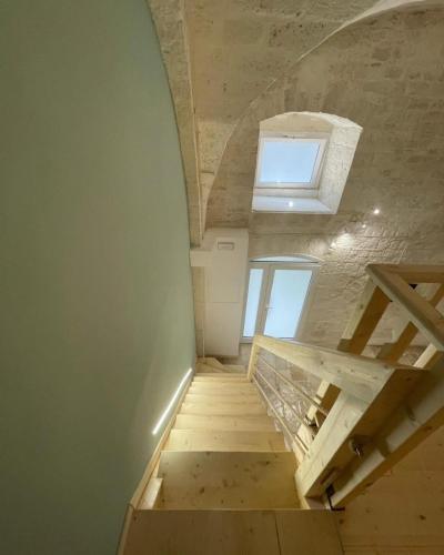 a staircase leading up to a room with a window at Dimora Barone II in Bitetto