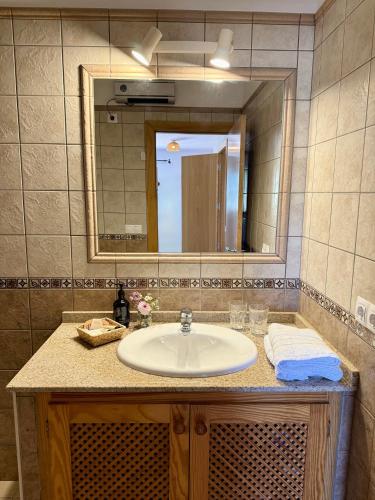 a bathroom with a sink and a mirror at Agroturismo Sa Marina - Adults Only in Cala Boix