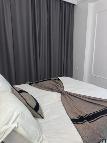 Katil atau katil-katil dalam bilik di Appartement calme et lux