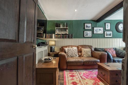 a living room with a couch and a table at The Boars Head Pub in Bishops Castle