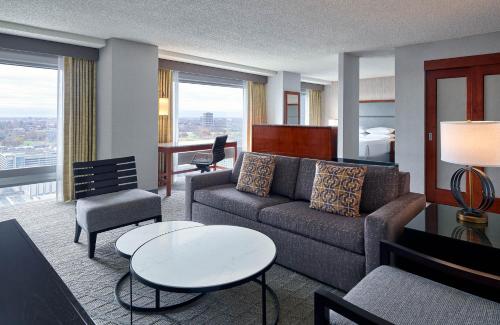a living room with a couch and a table at Sheraton Kansas City Hotel at Crown Center in Kansas City