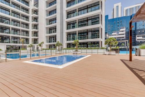 a courtyard in a building with a swimming pool at GLOBALSTAY Azizi Riviera 59 in Dubai