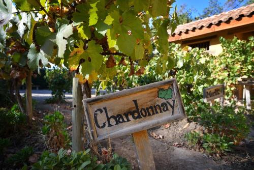 a sign for a garden in front of a house at Inca Hoteles in Los Andes