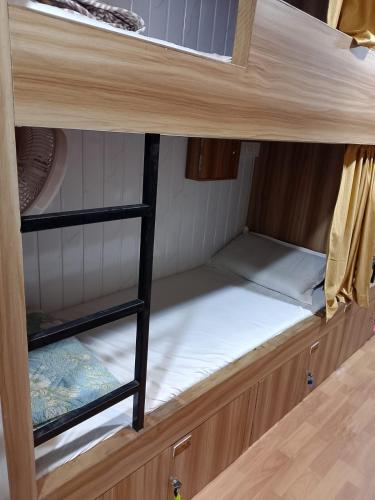 an empty bunk bed in a room with at Sun Shine AC Dormitory in Mumbai