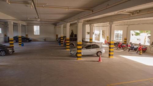 a parking garage with a car parked in it at Hotel Porto Napolis in Eunápolis