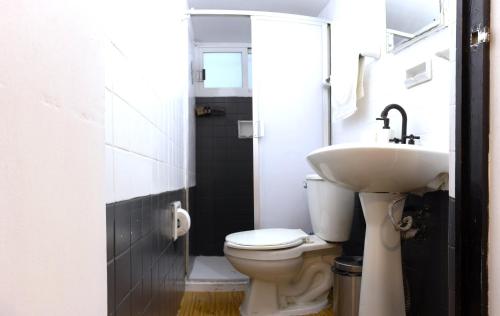 a bathroom with a toilet and a sink at Best location in Mexico City Cozy Master Suite in Mexico City