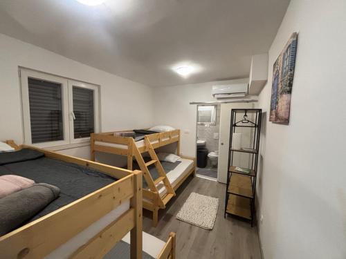 Postel nebo postele na pokoji v ubytování Apartman Rita