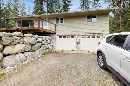 a white car parked in front of a house at Gold Rush Deck in Coeur d'Alene