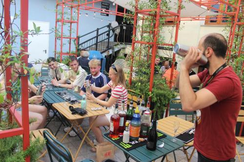 a man taking a picture of a group of people sitting at tables at YellowSquare Milan in Milan