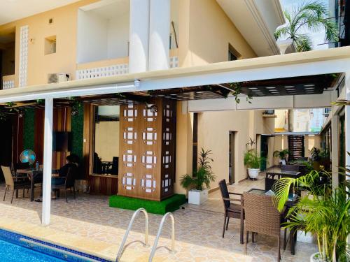 a resort with a swimming pool and a hotel at Presken Hotel @Oniru in Lagos