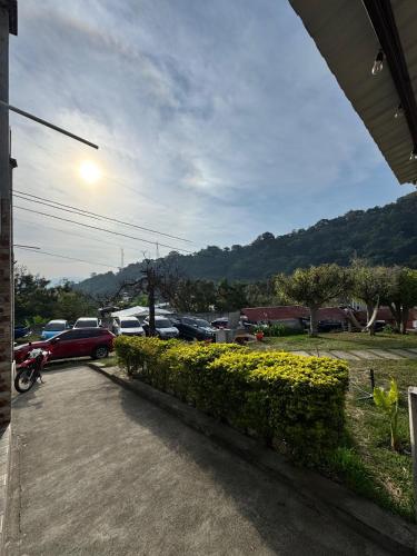 a view of a parking lot with cars parked at Hotel Mercy in San Juan La Laguna