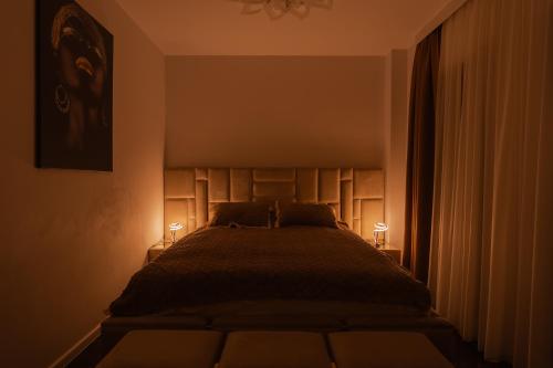 Ένα ή περισσότερα κρεβάτια σε δωμάτιο στο Adela & Robert Home cu piscină și parcare privată