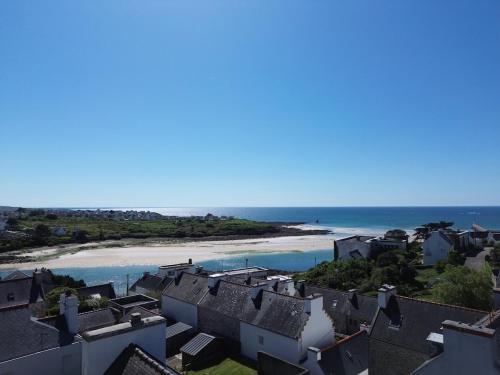 a view of a beach with houses and the ocean at Escape, splendid ocean view in Audierne