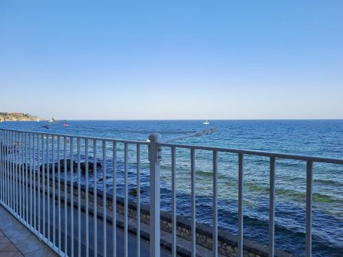 a view of the ocean from a pier at Almarè House in Giardini Naxos