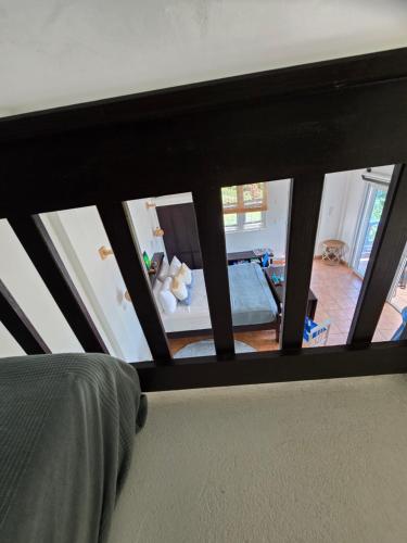 a view of a living room from a bedroom at Hodges Bay House in Calibishie