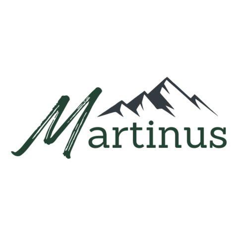 Un certificado, premio, letrero u otro documento en Haus Martinus
