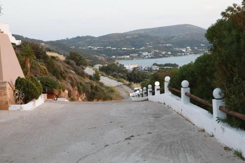 a road leading down a hill with a view at Ioli Luxury Apartment in Gourna