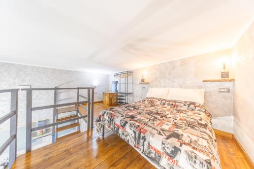 Un ou plusieurs lits dans un hébergement de l'établissement M r Loft apartment esclusivo con vasca idromassaggio