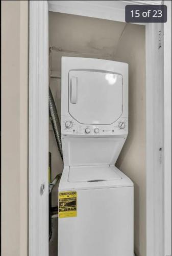 a washer and dryer sitting in a room at Property near to Airport and Free Parking in Ascalon