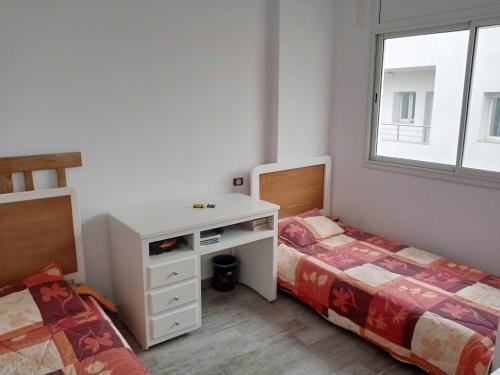 Postel nebo postele na pokoji v ubytování Appartement ksila