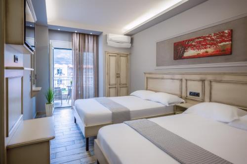 A bed or beds in a room at Carpe Diem Rooms Nei Pori