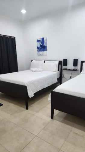 Katil atau katil-katil dalam bilik di Sweet Sunset 6 Playa Rompeolas Aguadilla
