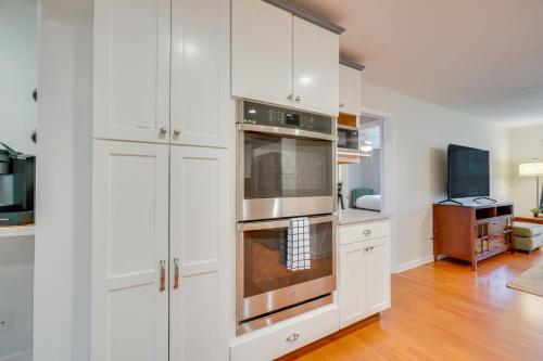 a kitchen with white cabinets and a stainless steel oven at Hike, Fish and More Home on 5 Acres in Crossville! in Crossville