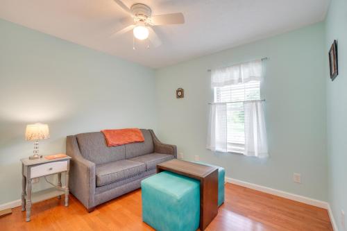 a living room with a couch and a table at Hike, Fish and More Home on 5 Acres in Crossville! in Crossville