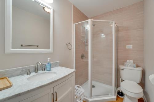 a bathroom with a shower and a sink and a toilet at Hike, Fish and More Home on 5 Acres in Crossville! in Crossville