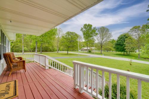 a porch with a chair and a view of a park at Hike, Fish and More Home on 5 Acres in Crossville! in Crossville