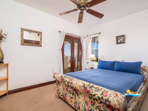 a bedroom with a blue bed and a couch at 3-Bedroom El Dorado Ranch Rental with Beach View in San Felipe