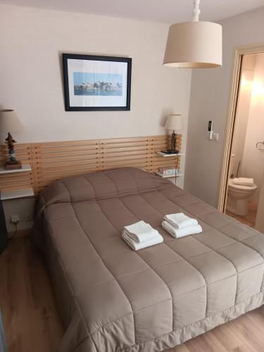 Postel nebo postele na pokoji v ubytování L'Escale chambres privées chez l'habitant JFDL