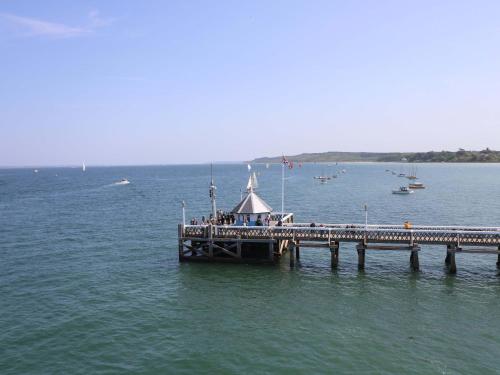 a pier in the water with a group of people on it at Whitfield P1 in Yarmouth