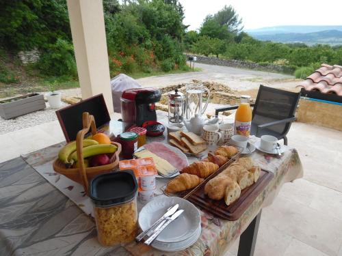 a table with a bunch of food on it at Coeur de Bonnieux in Bonnieux