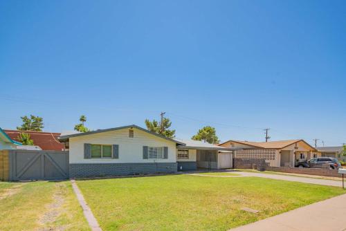 a house with a driveway and a yard at Near Mntn Park Private Pool & Fully Fenced Yard in Phoenix
