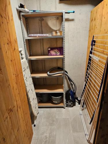 a room with a closet with shelves and a door at Chesa Bunita Dus in Gaschurn