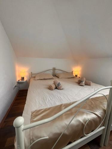 a bed in a room with two pillows on it at Old Town in Sarajevo