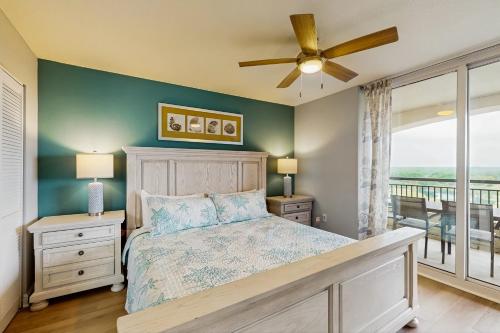 a bedroom with a bed and a ceiling fan at Tilghman Beach and Golf 1519 in North Myrtle Beach