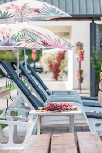 a tray of fruit sitting on a table on a patio at Delta apartments in Bihać