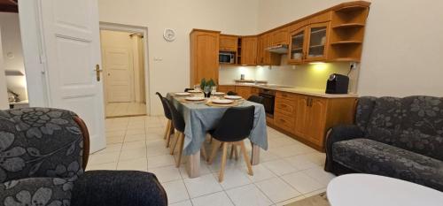 a kitchen with a table and chairs in a room at Old Town Home Prague in Prague