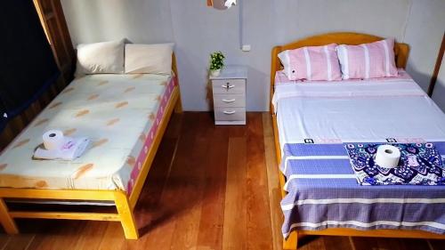 Postel nebo postele na pokoji v ubytování Refugio Chabelita Hostel