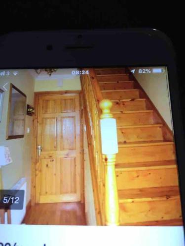 a view of a staircase with a wooden door at Sea View in Balnacart