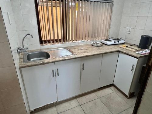 Kuchyň nebo kuchyňský kout v ubytování M&D Guest House